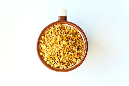 Bee pollen grains in a cupの写真素材