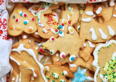 Box of Christmas butter cookies with colorful decorations.の写真素材