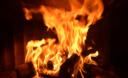 Fire flames in fireplace. Burning wood.
