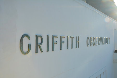 LOS ANGELES, CA, USA - MARCH 28, 2018 : Griffith Observatory name on the building. Griffith Observatory is located on the slope of Mount Hollywood in Los Angeles Griffith park.のeditorial素材