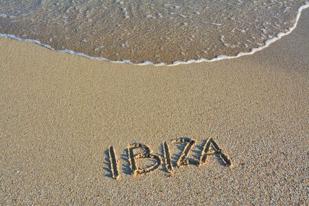 Sandy beach and wave on Ibiza island.の写真素材