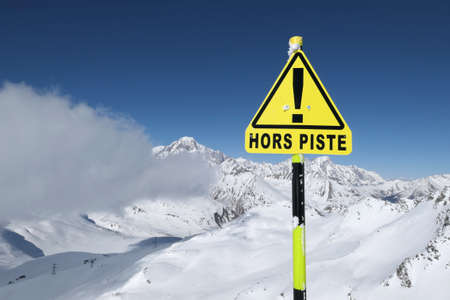 Warning sign 'Hors piste' means Off piste in La Rosiere ski resort. Mount Blanc winter scenic view.の写真素材