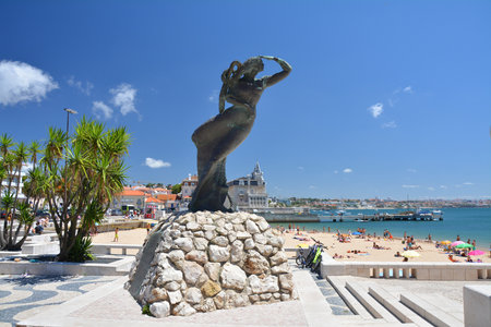 Cascais, Portugal - July 4, 2021: Monumento aos Descobrimentos Portugueses in Cascais in Portugal. Statue of woman looking like mermaid by Praia da Ribeira.のeditorial素材