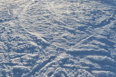 Snow texture at the ski slope. Winter background.