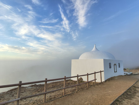 Cabo Espichel landscape. Ermida da Memoria chapel on the edge of the cliff.の写真素材