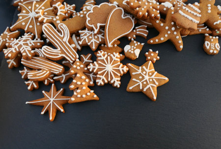 Christmas gingerbread cookies on black background.の写真素材