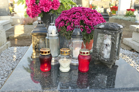 Candles on the grave. Decorations on grave at All the Saints Day holiday on 1 November in Polandの写真素材