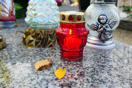 Burning candle on the grave. All the Saints Day holiday on 1 November in Polandの写真素材