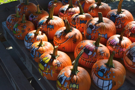 Wawrzenczyce, Poland - September 10, 2021: Halloween colorful decorated painted pumpkins with faces collection at farm shop.のeditorial素材
