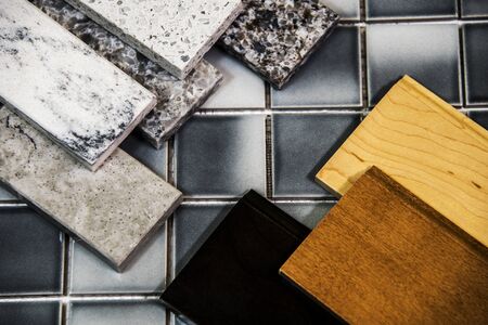 Kitchen counters and kitchen cabinet colors samples over floor tiles