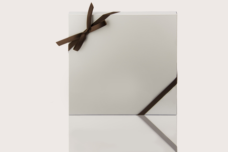 Modern white kitchen cabinet door on glossy tableの写真素材