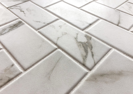 White marble tiles with gray grain design, can be used as floor and wall tiles and can be used as kitchen backsplashの写真素材