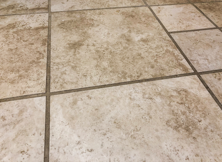 Granite brown and beige square tiles plased horisontal in straght lines , can be used as floor and wall tiles and can be used as kitchen countertop backsplashの写真素材