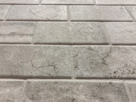 Gray tiles horizontaly layed in stretcher bond,can be used as floor tiles or kitchen countertop becksplashの写真素材