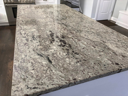 dark and gray granite countertop inside kitchen on islandの写真素材
