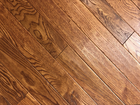 Brown red new installed hardwood floor made of maple woodの写真素材