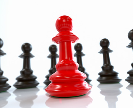 Leadership concept, red pawn of chess, standing out from the crowd of blacksの写真素材