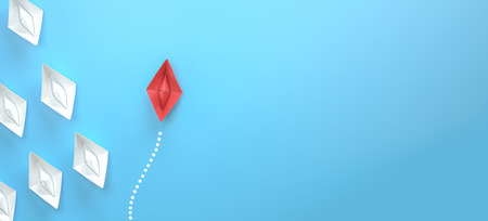 paper boat leadership concept - red paper boat leading the rowの写真素材