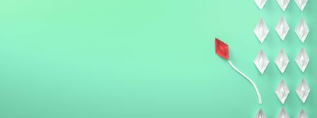 paper boat leadership concept - red paper boat leading the rowの写真素材