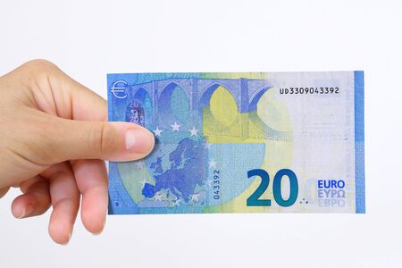 Hand holding a euro bank note