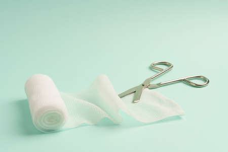 Close up view of single bandage and specialistic scissors onの写真素材