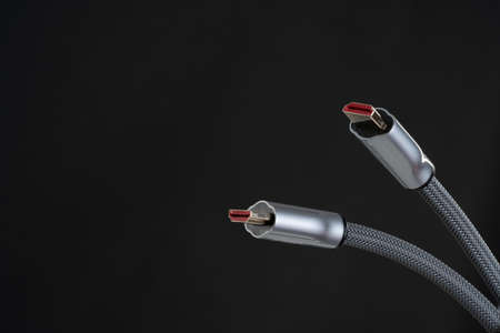 A close up photo of hdmi cable on the black background