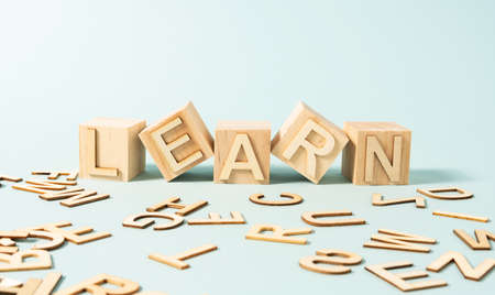 LEARN word on wooden cubes on the light blue backgroundの写真素材