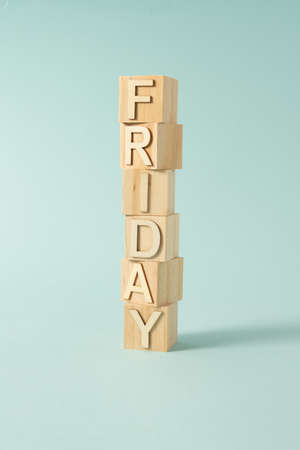 Friday sign on wooden cubes on the colorfull backgroundの写真素材