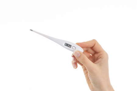 A close up picture of woman showing a thermometer with 38.3 degree.