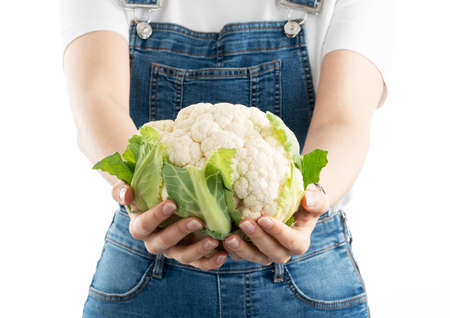Young happy woman with fresh cauliflower. Choosing a healthy diet and life style.