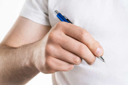 A close up image of Man's hand holds a pen isolated on white background