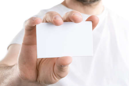 Mockup of man's hand holding a bussines card, isolated on white backgroundの写真素材