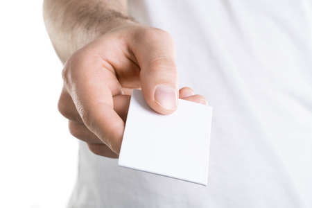 Mockup of man's hand holding a bussines card, isolated on white backgroundの写真素材