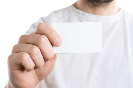 Mockup of man's hand holding a bussines card, isolated on white backgroundの写真素材