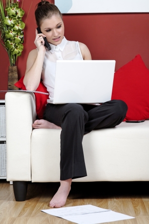 Young woman working from home on a laptop computerの写真素材