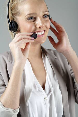 Call centre operator using a telephone headset.の写真素材