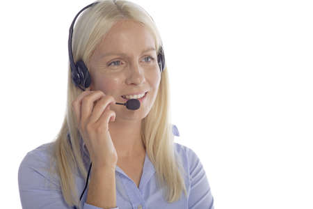 Young woman in smart clothes using a call centre head set
