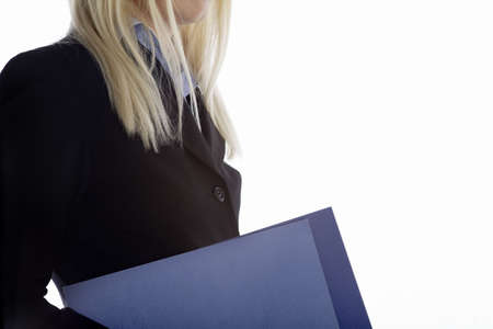 Young business professional holding blue folders on an isolated backgroundの写真素材