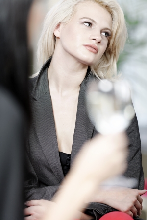 attractive woman waiting for someone at a wine bar.の写真素材
