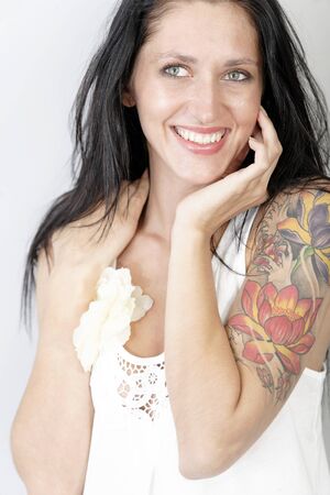 Portrait of a beautiful young woman with a tattooの写真素材