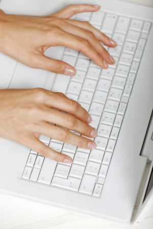 Modern computer keyboard with female hands typingの写真素材