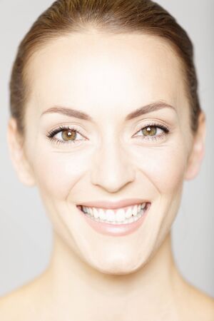 Beautiful young womans face in a beauty style poseの写真素材