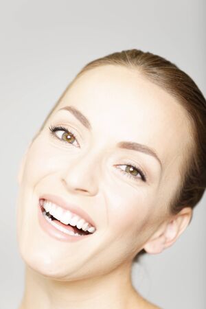 Beautiful young womans face in a beauty style poseの写真素材