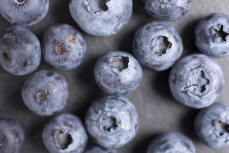 Summer ripe blueberries on black slateの写真素材