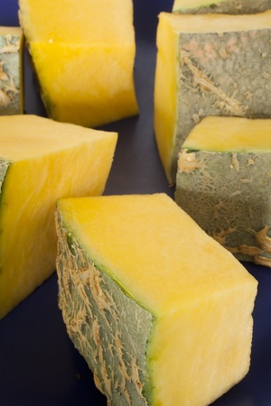 yellow diced pumpkin on a plateの写真素材