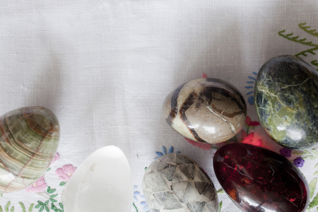 traditional easter eggs on floral tableclothの写真素材