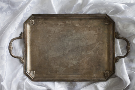 retro tray on white tableclothの写真素材