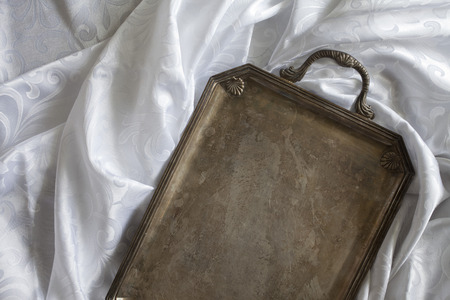 retro tray on white tableclothの写真素材