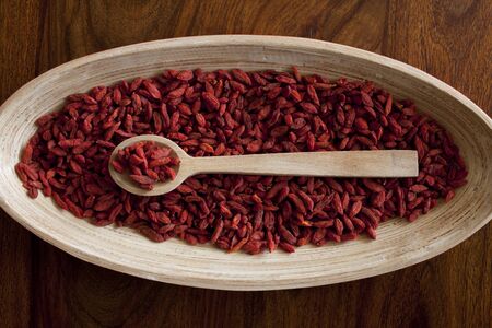 Goji berries on the wooden table