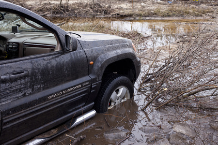 Warsaw, Poland - March 4, 2017:  Jeep Grand Cherokee on a rural road near Warsaw during the offroad race 4, March, 2017.のeditorial素材